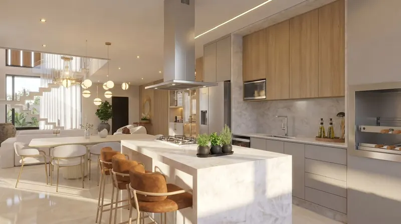 Cozinha integrada com ilha central em mármore